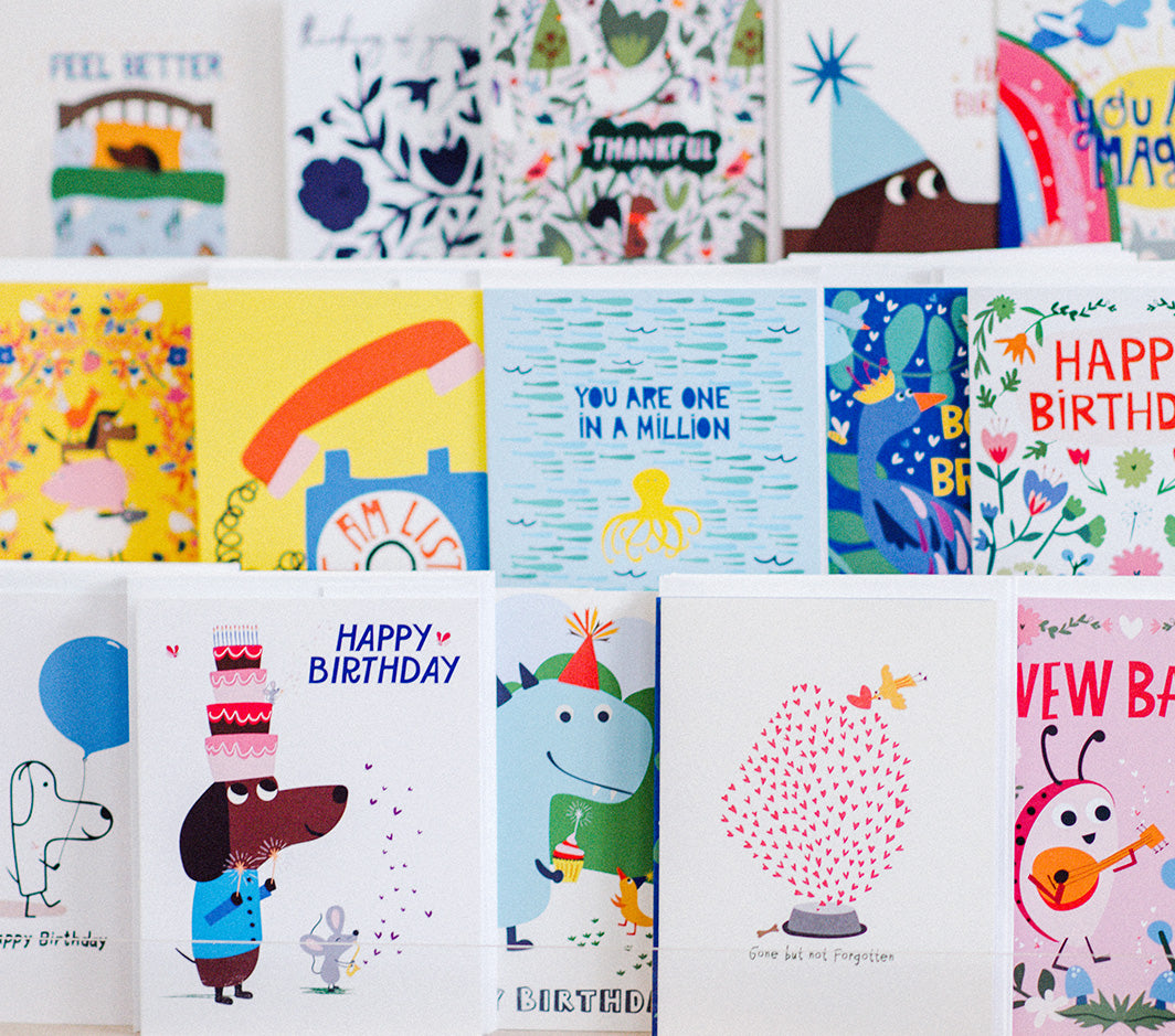 Collection of various greeting cards with different designs and messages.