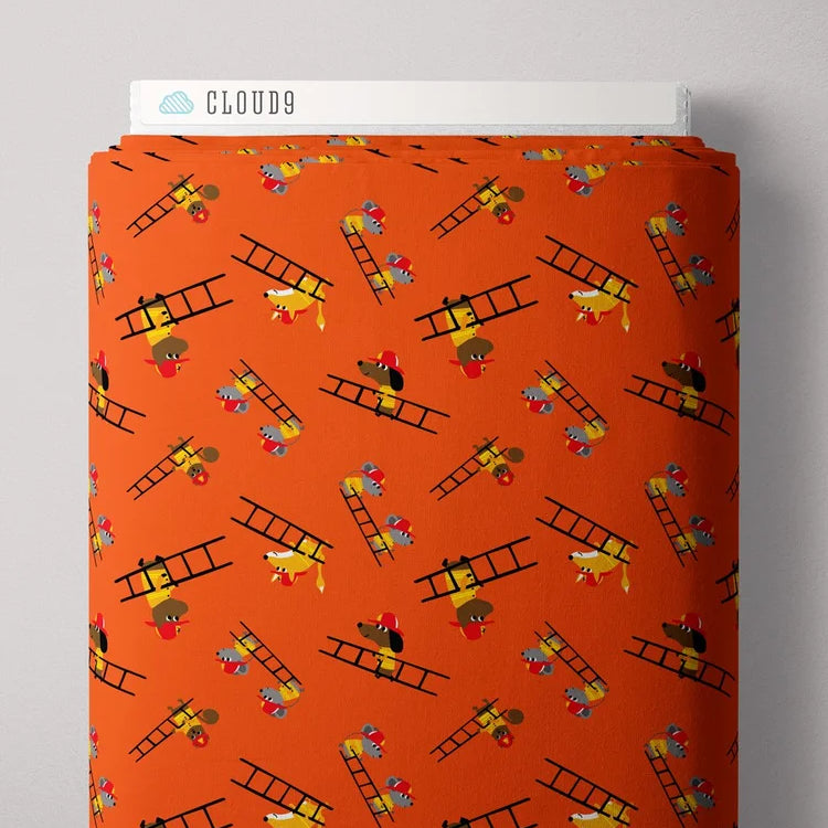 Orange fabric with ladder and fire truck pattern, displayed on a gray background.