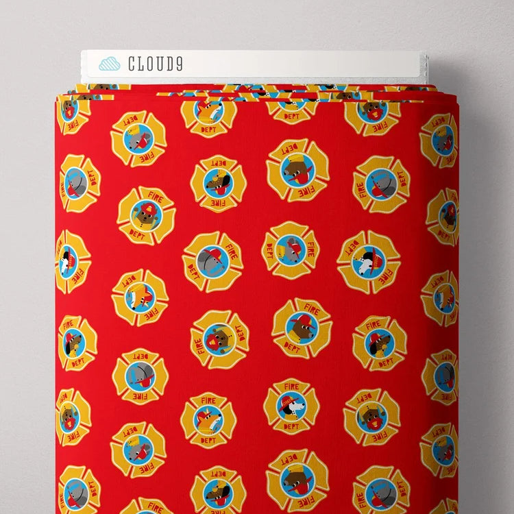 Red fabric with yellow and blue designs on a gray background