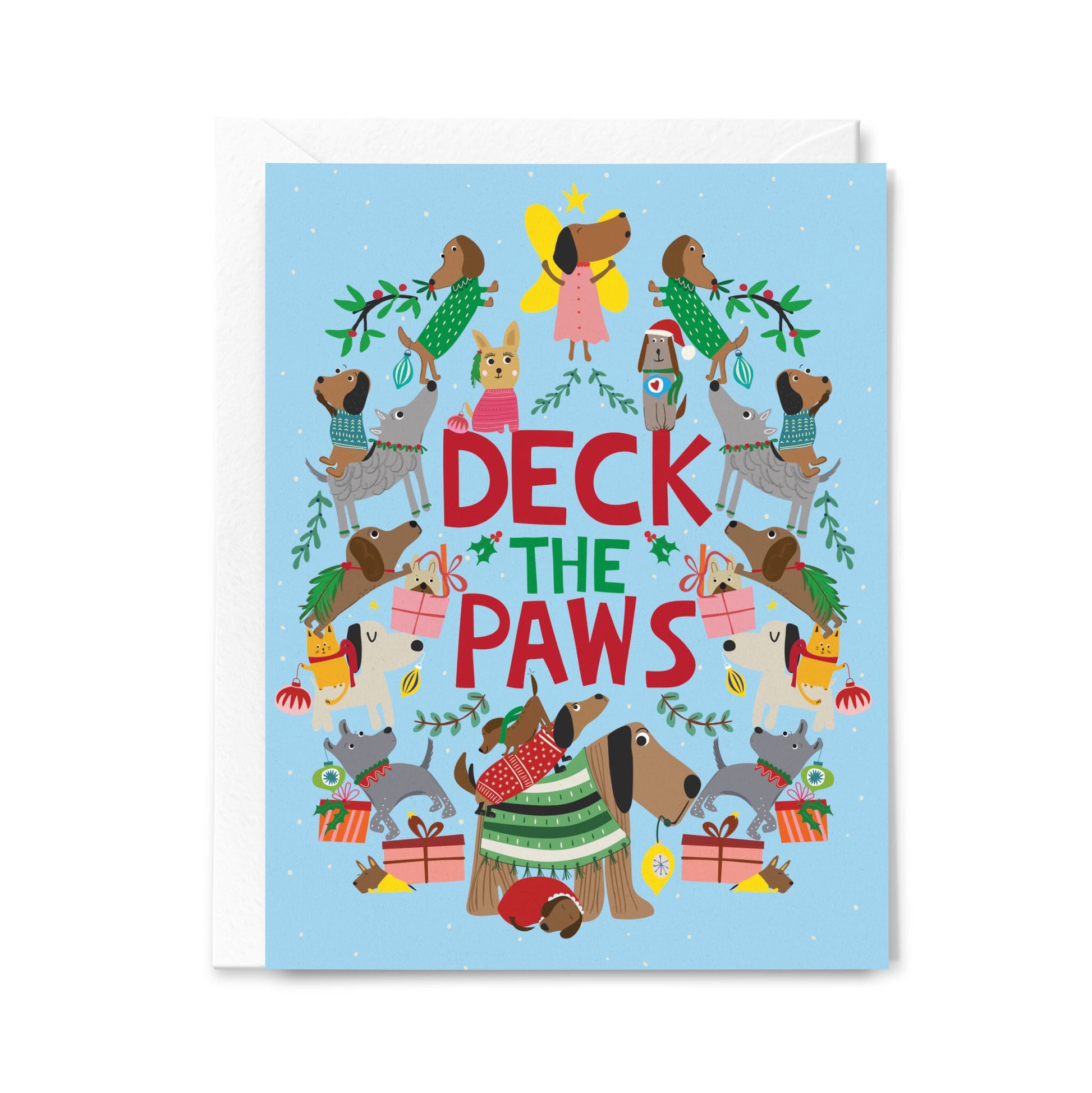 Christmas card with dogs and 'Deck the Paws' text on a light blue background