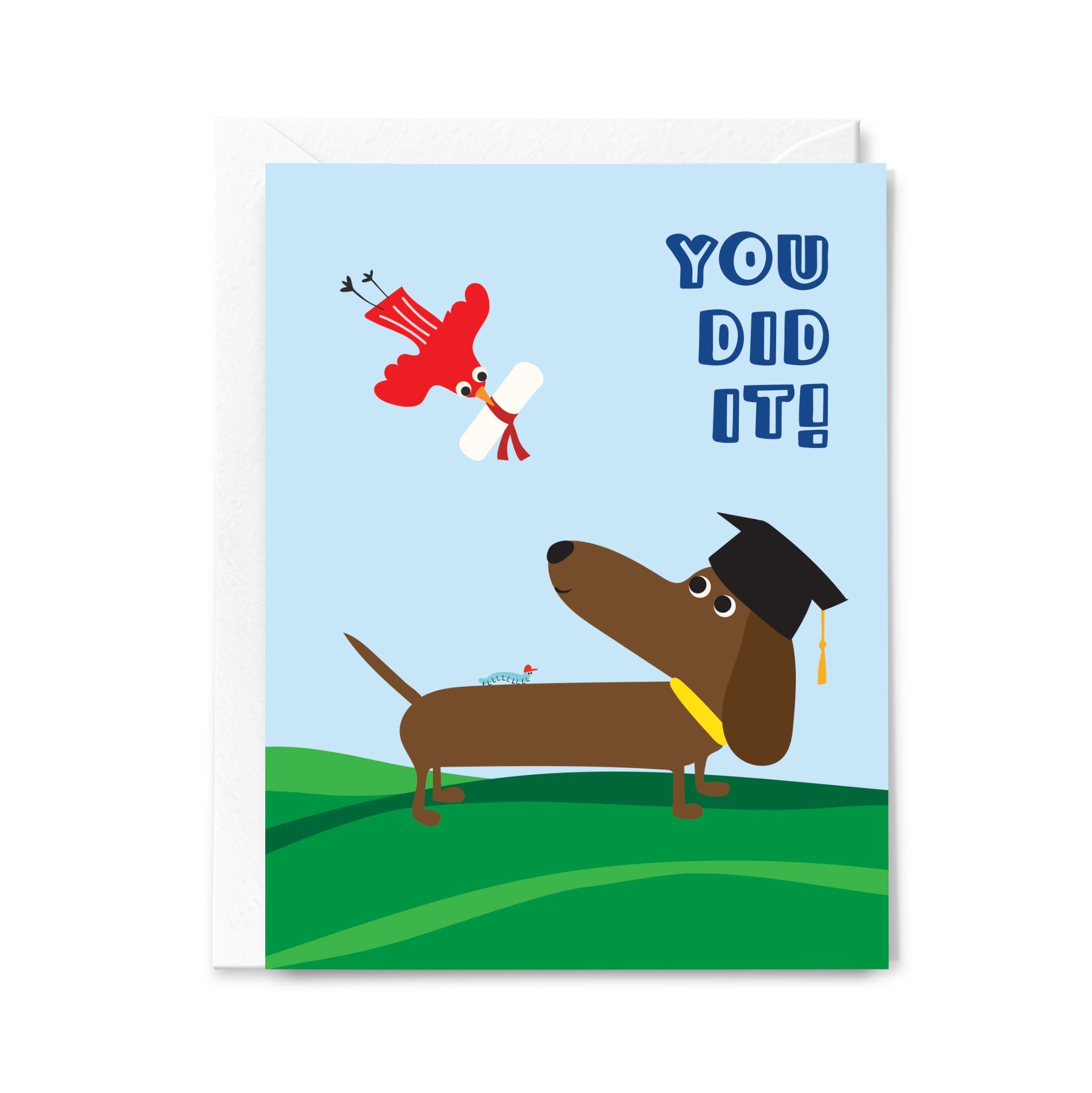 Graduation-themed greeting card with a dog wearing a cap and diploma, and a red bird flying above, on a light blue background.