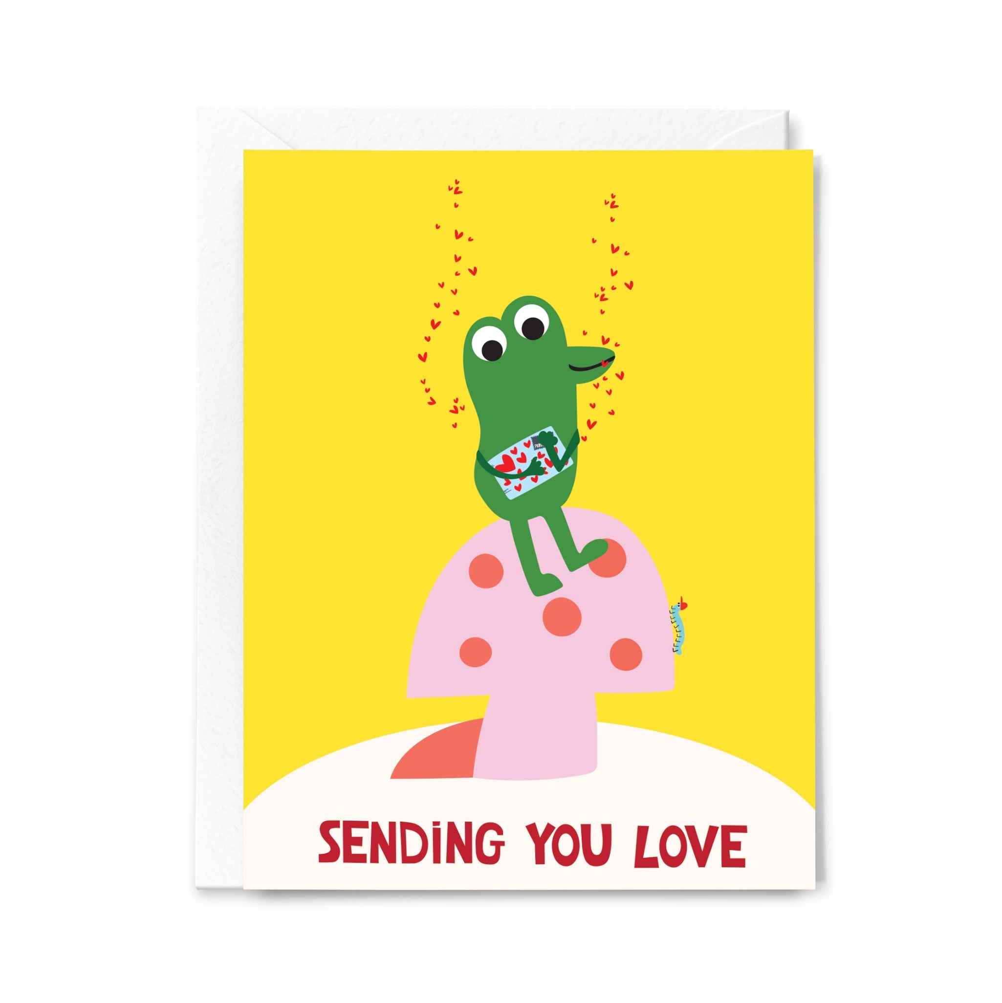 Greeting card with a green frog character on a pink mushroom, sending love, on a yellow background.