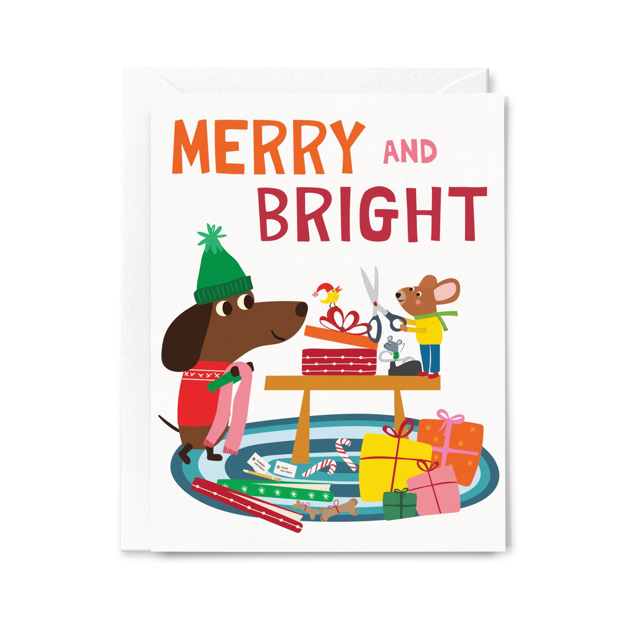 Christmas card with a dog and mouse preparing presents, featuring 'Merry and Bright' text.