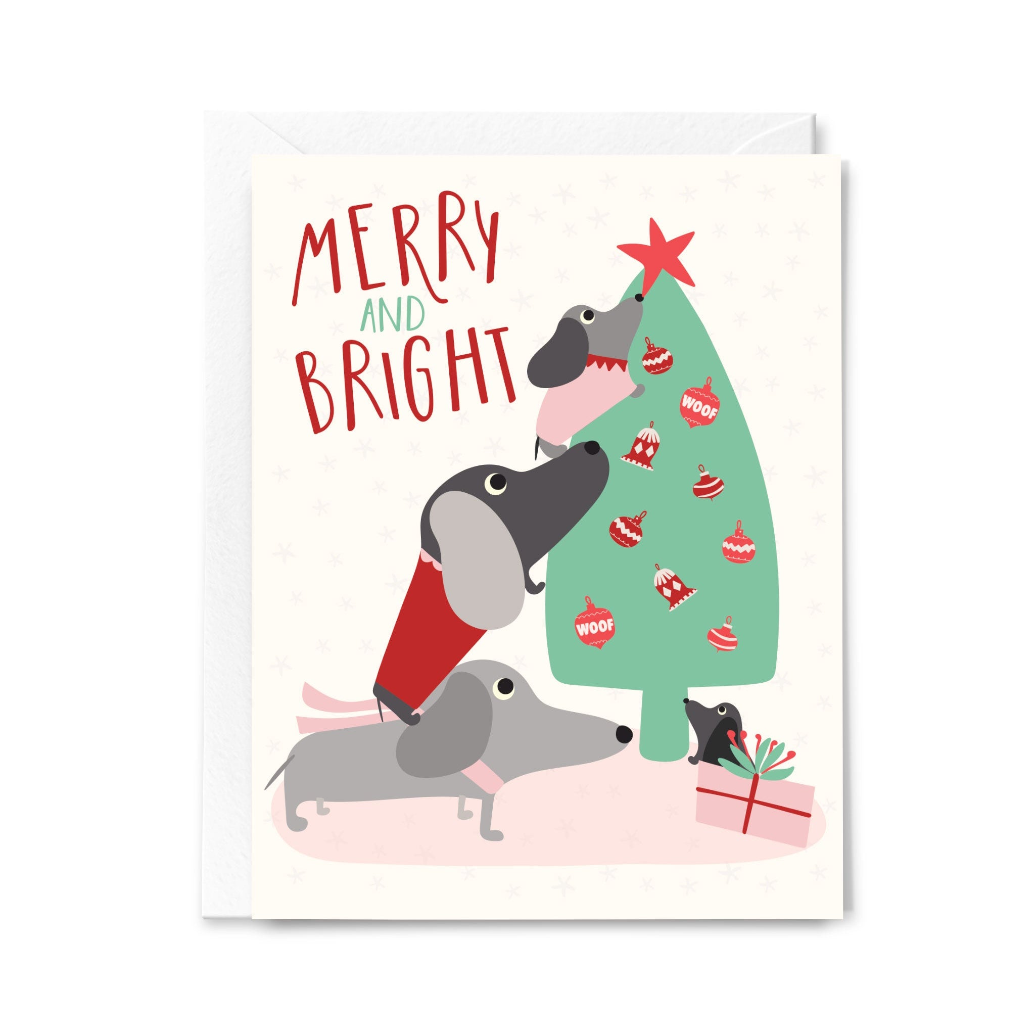 Christmas card with dogs around a decorated tree and 'Merry and Bright' text.