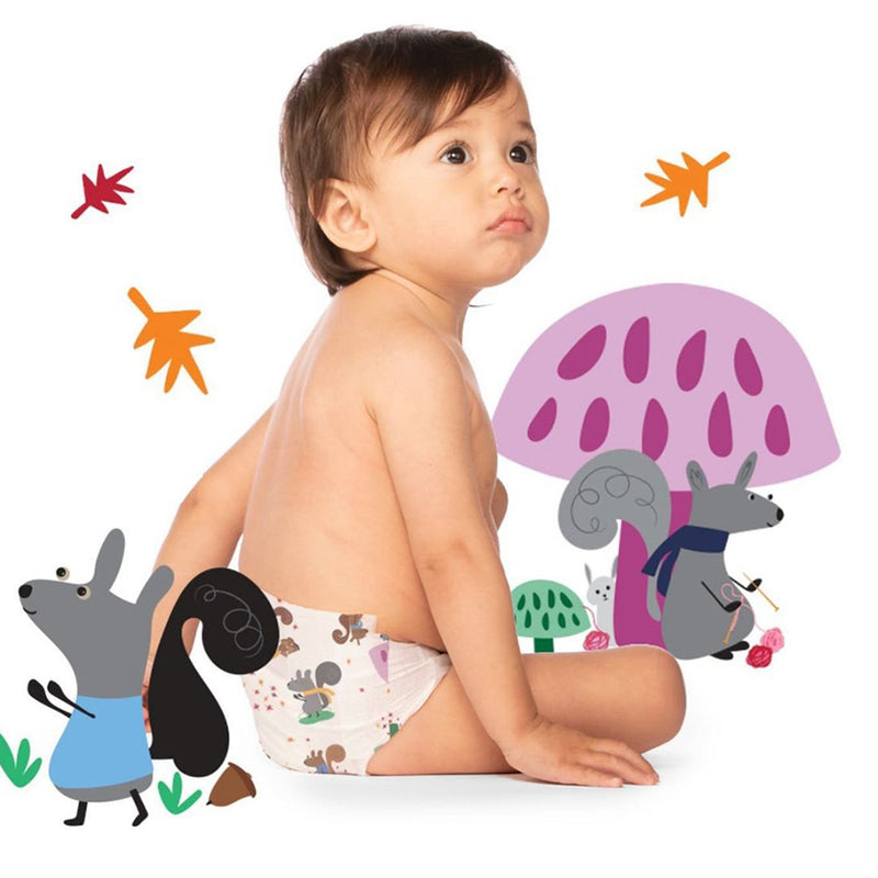 Child wearing a diaper with cartoon characters on a white background