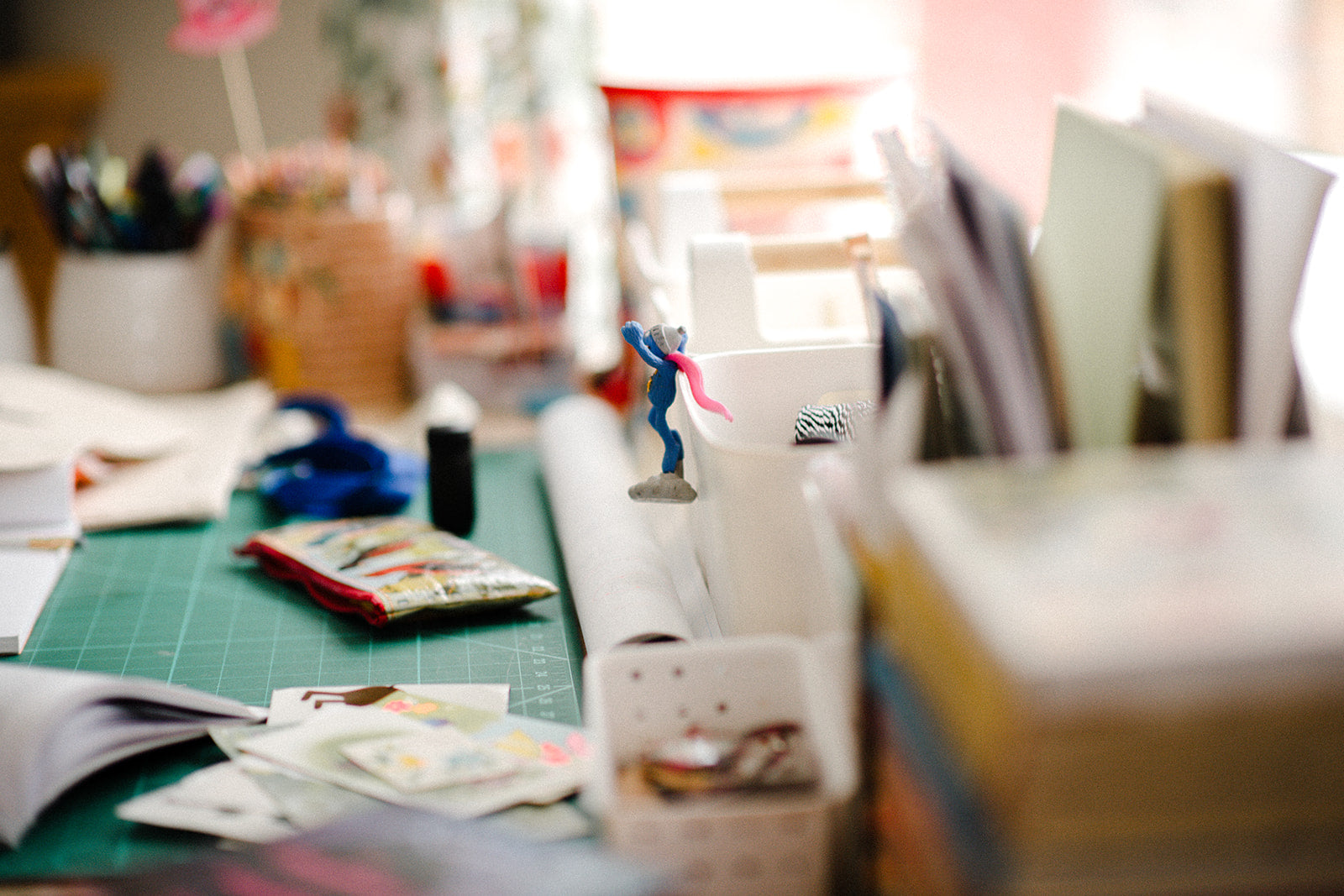 Blurred craft room with supplies and tools on a table