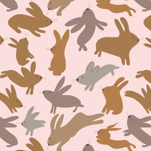 Pattern of brown, gray, and beige rabbits on a light pink background
